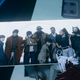 A photograph of Deathloop's main characters sits on a table.